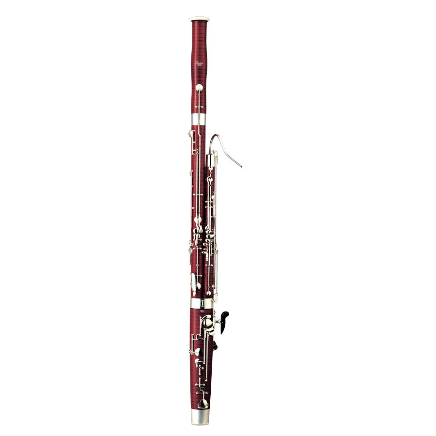 A maplewood bassoon in front of a white background